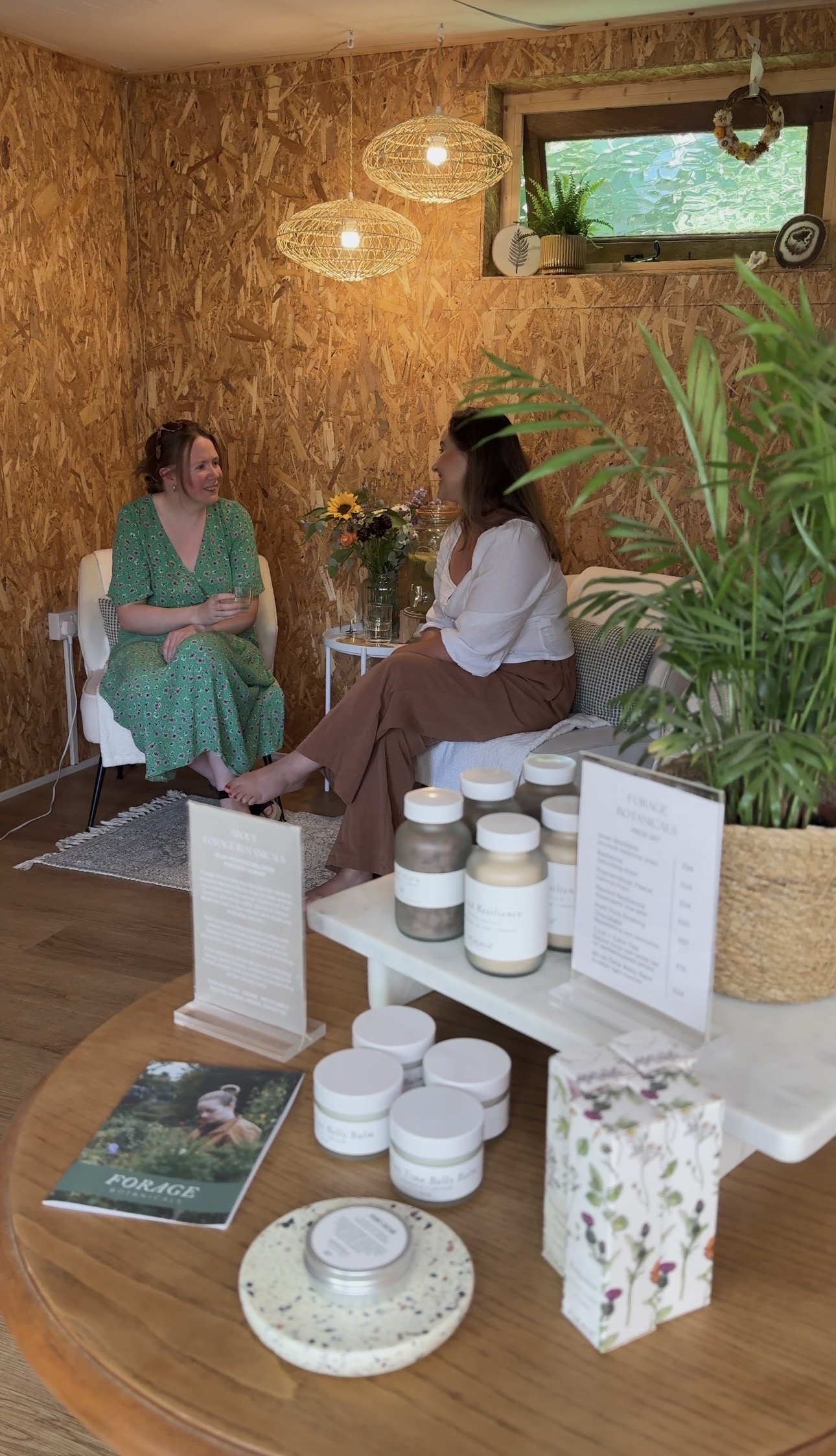 A relaxed consultation in the treatment room among plants and skincare